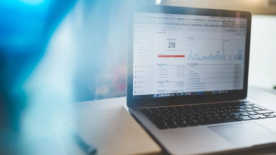 Laptop showing a web analytics dashboard, illustrating how to track AI search visibility in Google Search Console